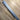 Voron Legacy carbon fiber shaft against a metric rule