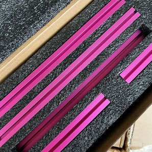 Pink anodized MakerBeam XL 15x15 extrusions packed in foam for Pandora's Box frame kit