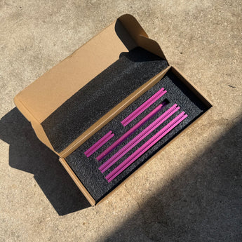 Matte pink Baby Legacy 1515 aluminum extrusion frame kit in its foam-lined box